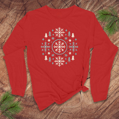 Red long-sleeve shirt with a snowflake and tree design on a wooden surface