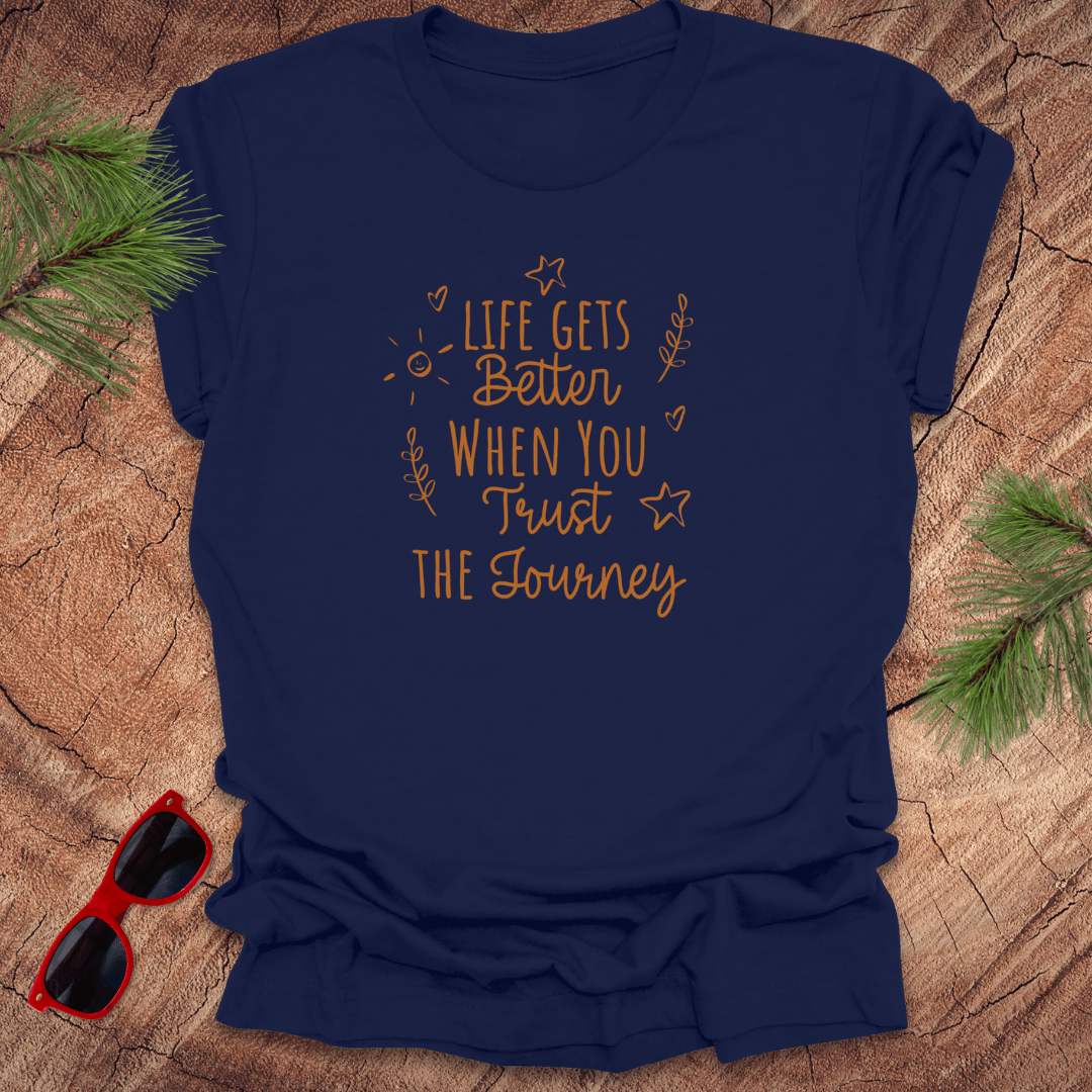 navy tshirt with text life gets better when you trust the journey, on a wood background