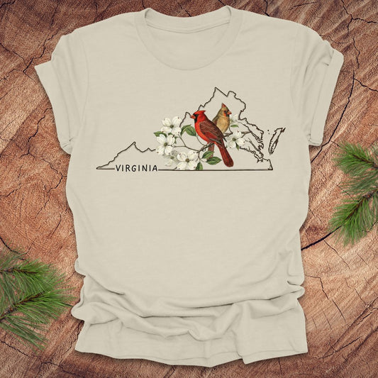 Beige t-shirt with Virginia map and cardinal design on a wooden surface