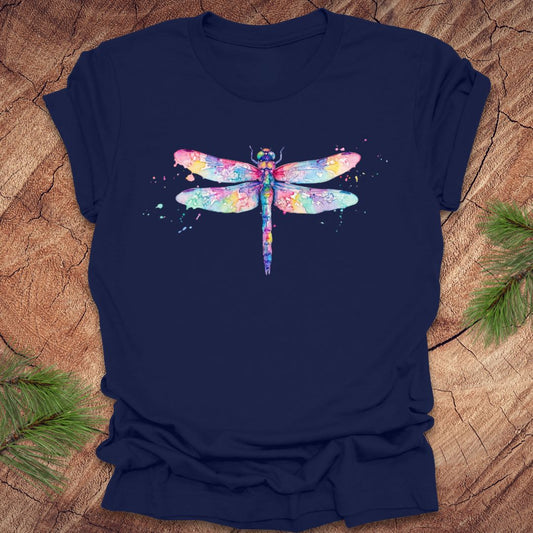 Navy blue t-shirt with a hand painted pastel watercolor dragonfly on a wood background.