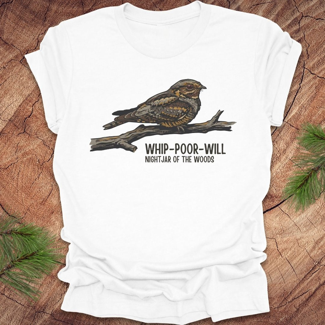 White t-shirt with a whip-poor-will bird on a branch with text 'nightjar of the woods' on a wood background.