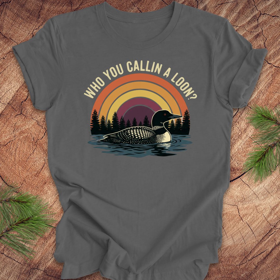 Gray t-shirt with a loon graphic and text 'who you callin a loon' on a wooden surface