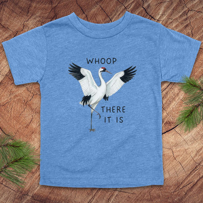 Blue t-shirt with a crane graphic and text on a wooden surface