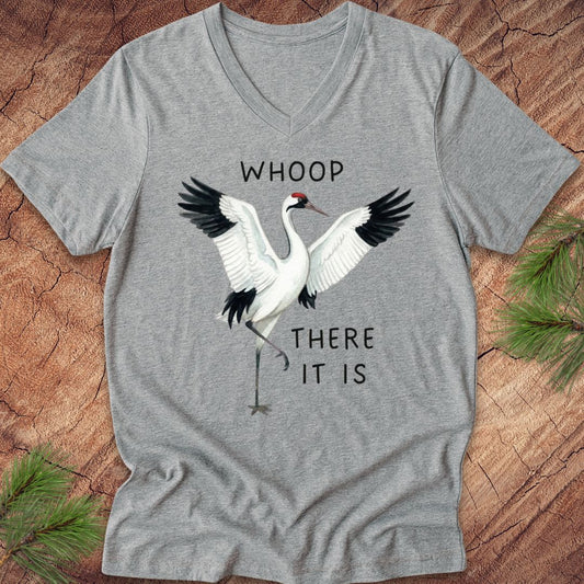 Gray t-shirt with a whooping crane graphic and text on a wooden surface