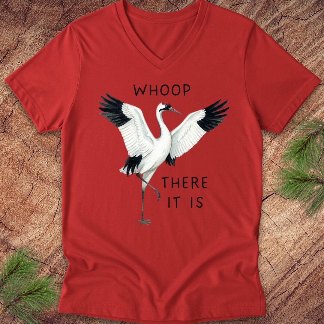 Red t-shirt with a whooping crane graphic and text on a wooden surface