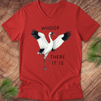 Red t-shirt with a whooping crane graphic and text on a wooden surface