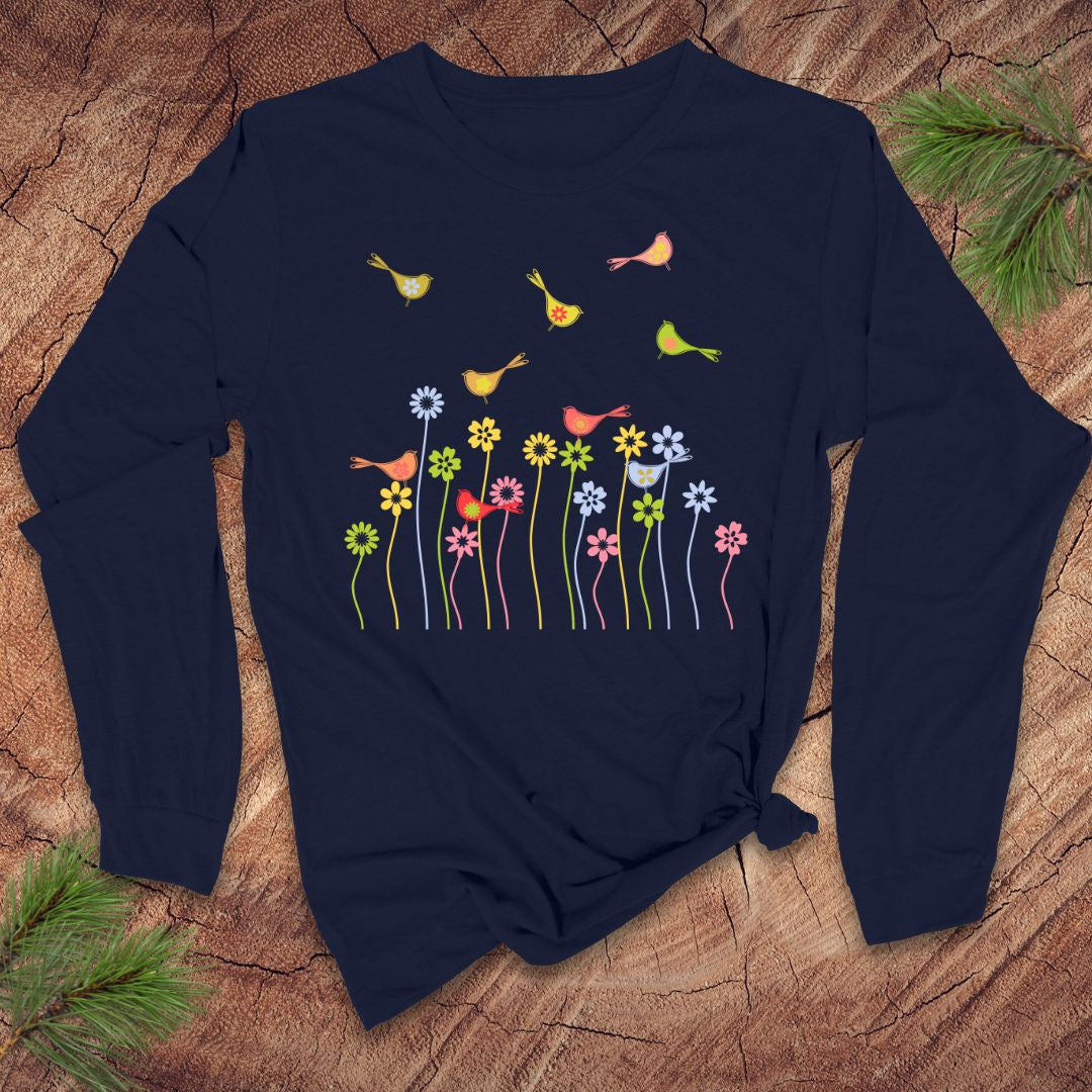 Navy blue long-sleeve shirt with colorful floral and bird design on a wooden surface.