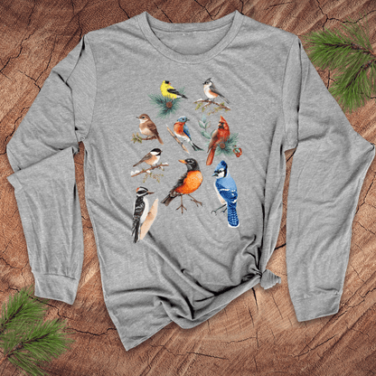 Gray long-sleeve shirt with bird illustrations on a wooden surface