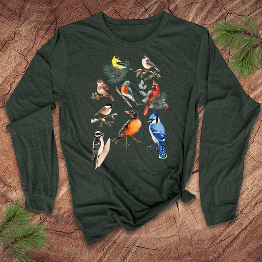 Green long-sleeve shirt with bird illustrations on a wooden surface