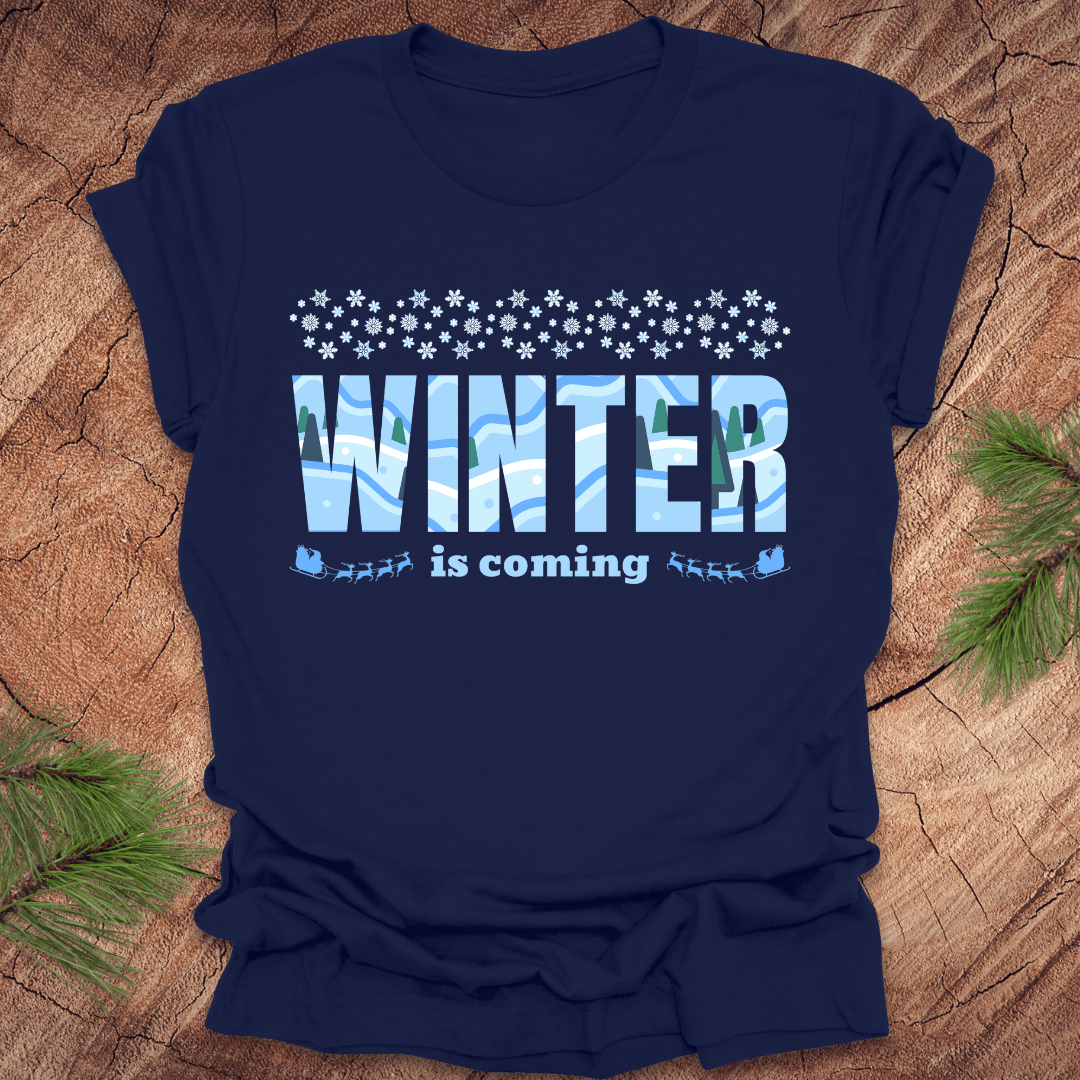 Navy blue t-shirt with 'Winter is coming' text on a wooden surface