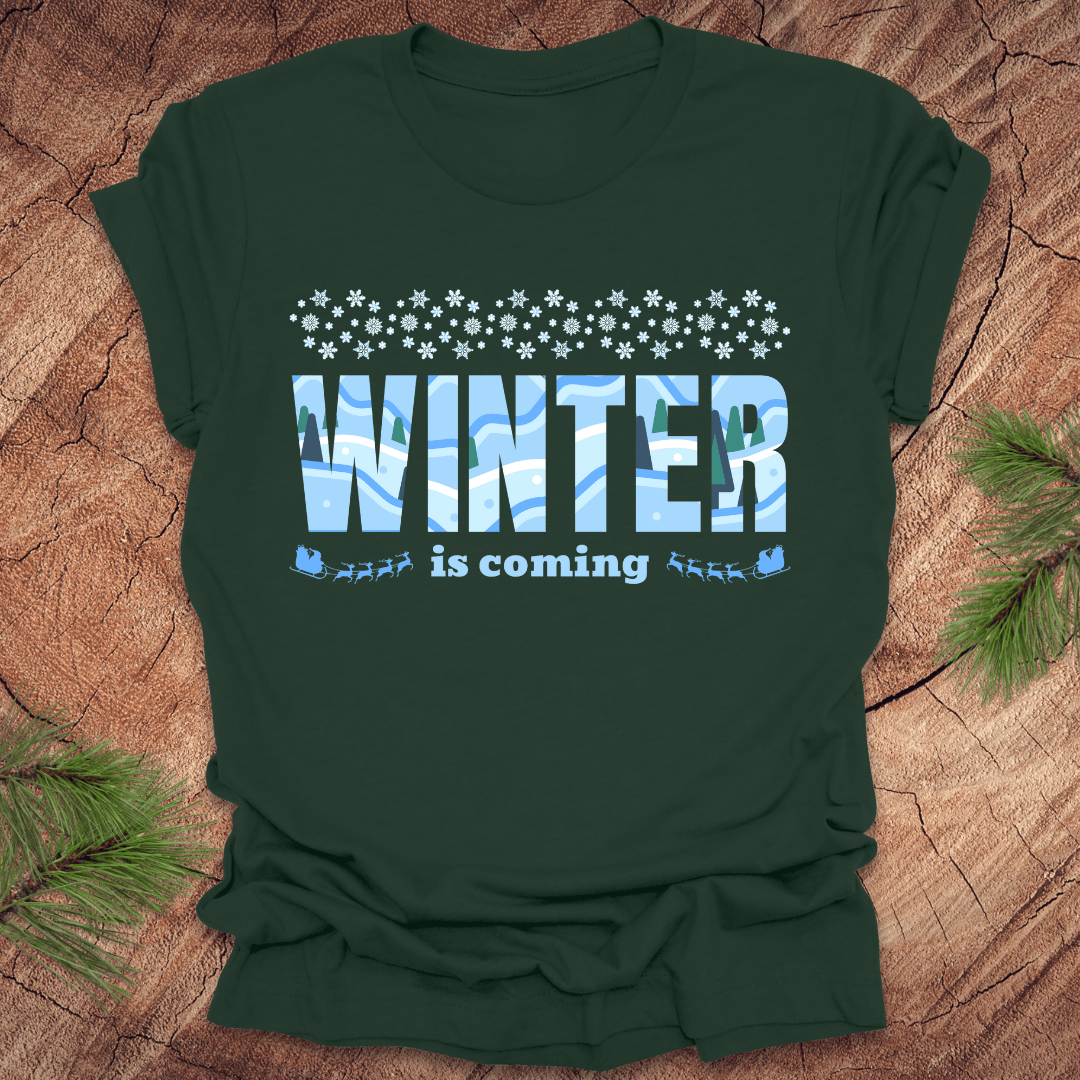 Green t-shirt with 'Winter is coming' text on a wooden surface