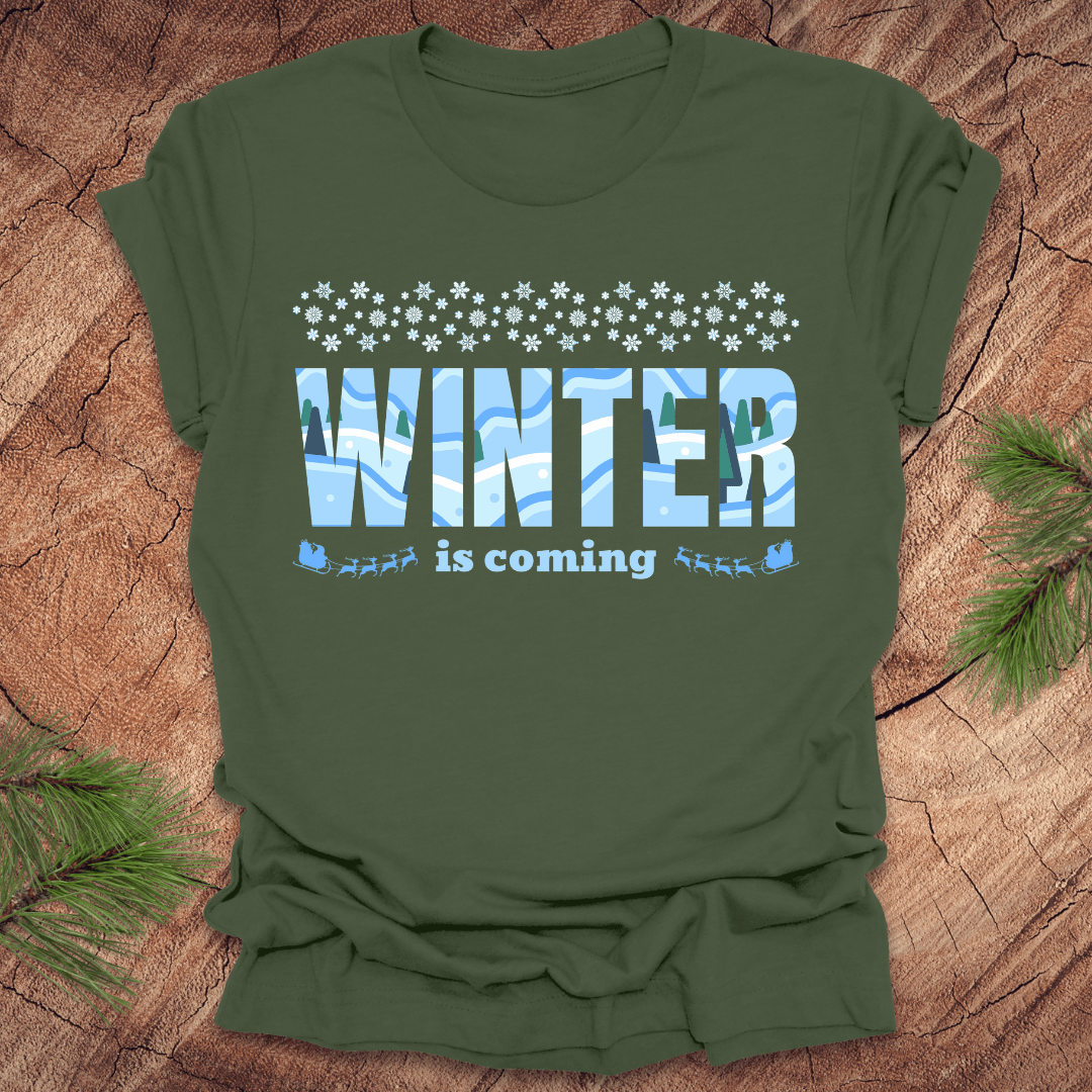 Green t-shirt with 'Winter is coming' text on a wooden surface
