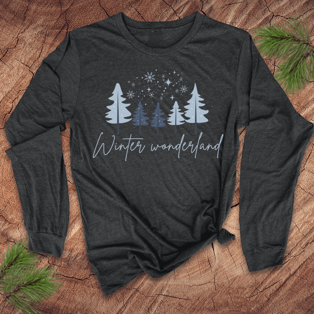 Dark long-sleeve shirt with 'Winter wonderland' text and tree design on a wooden surface.