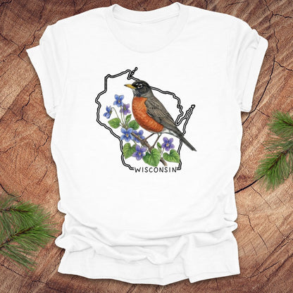 White t-shirt with a robin and Wisconsin outline design on a wooden surface.