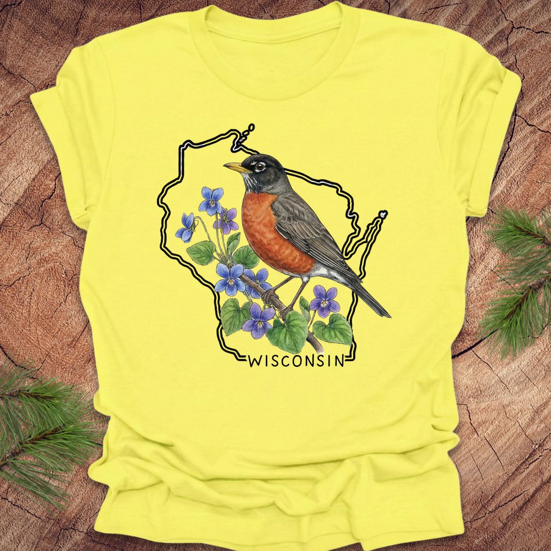 Yellow t-shirt with wisconsin outline, a robin and floral design on a wooden surface