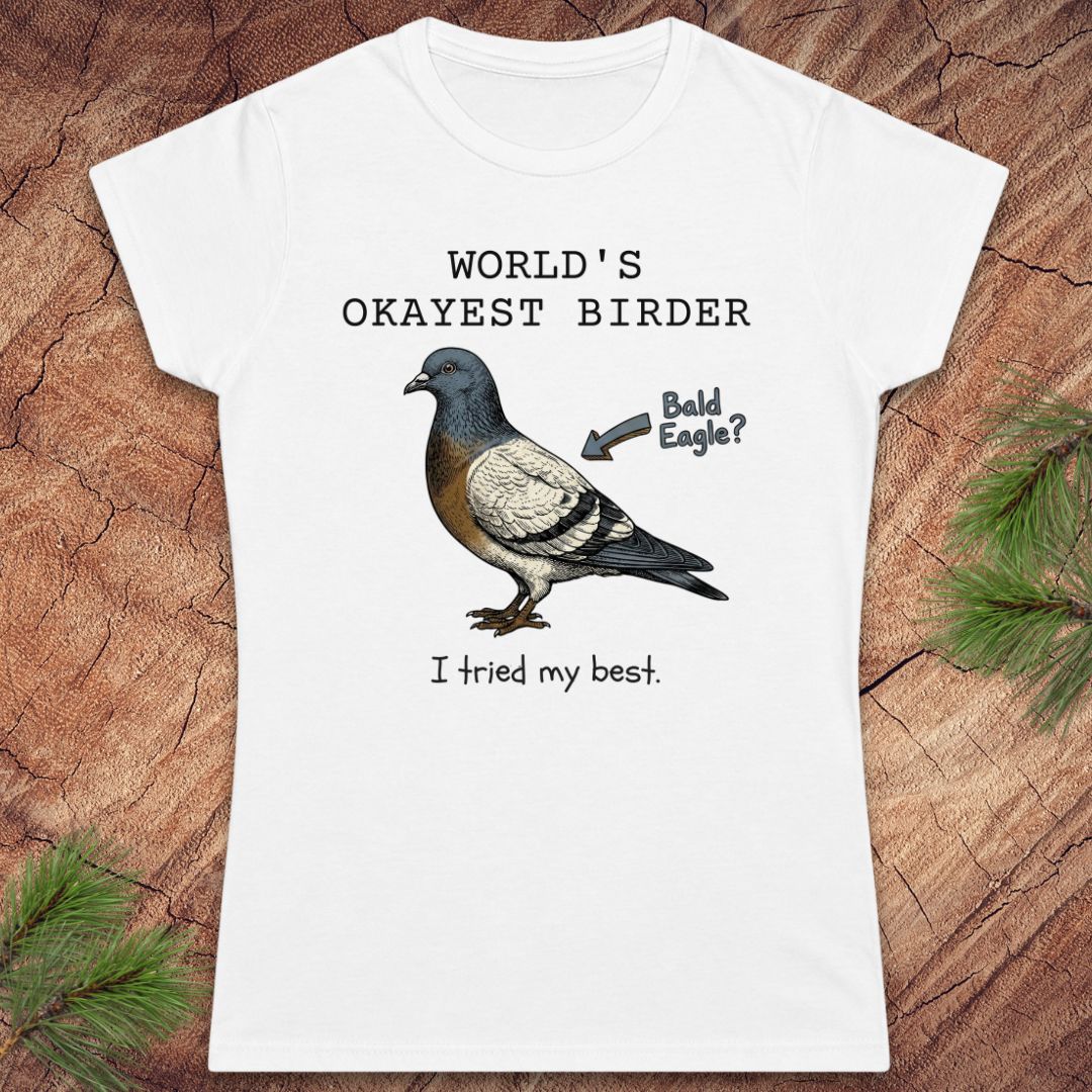 White t-shirt with a pigeon graphic and text on a wooden surface