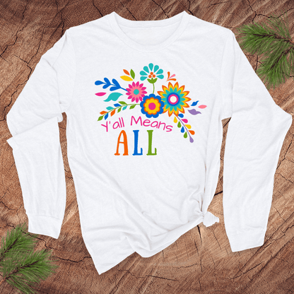 White long sleeve tshirt with colorful floral design and text, 'Y'all Means All' on a wooden surface