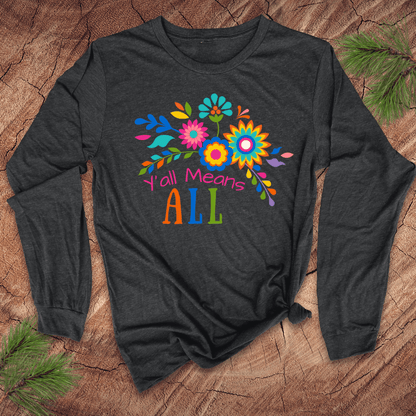 Dark gray long sleeve tshirt with colorful floral design and text, 'Y'all Means All' on a wooden surface