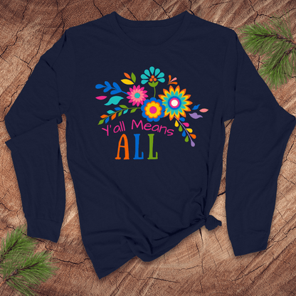 Navy blue long sleeve tshirt with colorful floral design and text, 'Y'all Means All' on a wooden surface
