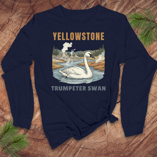 Navy blue long-sleeve tshirt with Yellowstone trumpeter swan design on a wooden surface