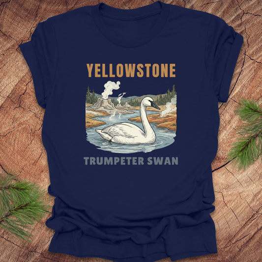 Navy blue t-shirt with Yellowstone swan design on a wooden surface