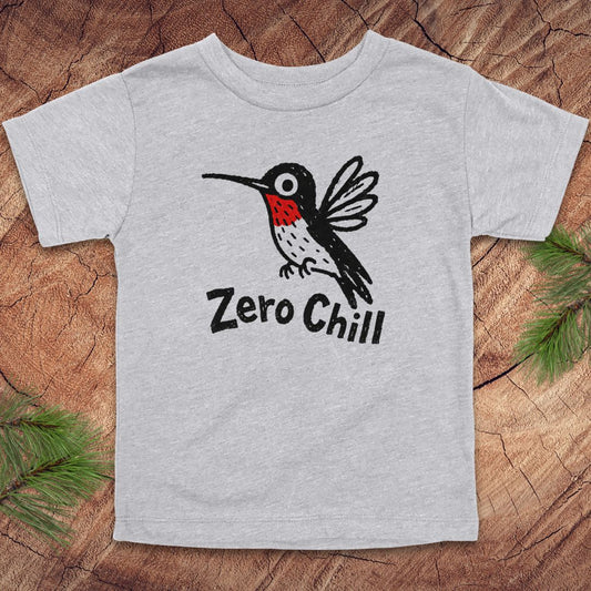 Gray t-shirt with a hummingbird graphic and 'Zero Chill' text on a wooden surface.