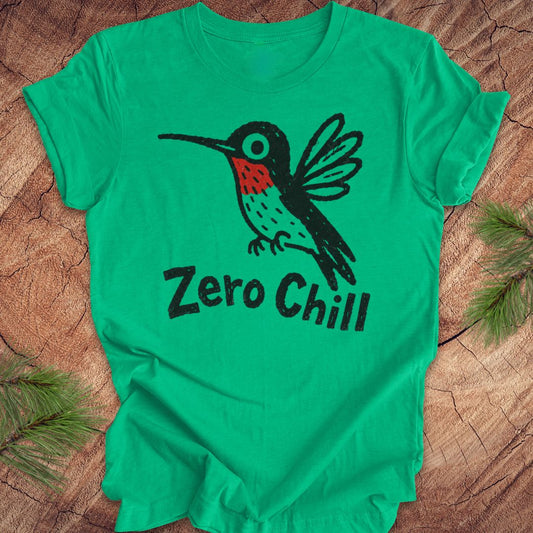 Green t-shirt with a black and red hummingbird graphic and 'Zero Chill' text on a wooden surface.